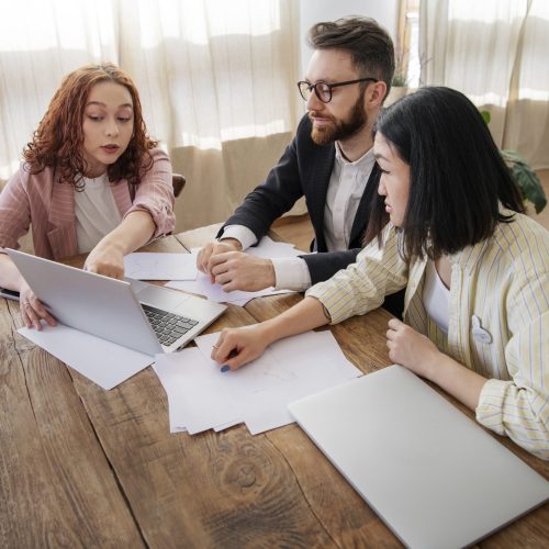 people-having-debate-while-looking-computer