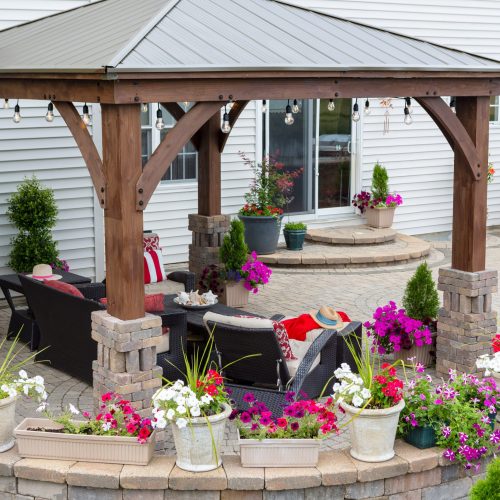 Colorful,Summer,Flowers,On,A,Curved,Exterior,Patio,With,Covered