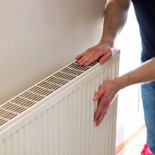 Man,Is,Checking,Radiator,Is,It,Heating.,Man,Warming,His