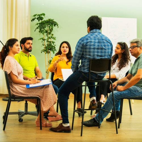 Indian,Asian,Group,In,A,Business,Meeting,,Discussing,Mental,Health