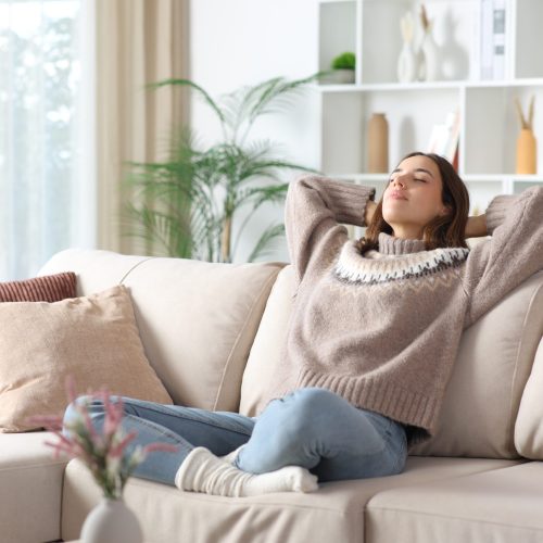 Relaxed,Woman,In,Winter,Enjoying,Free,Time,Sitting,On,A