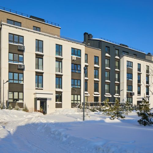 New,Modern,Block,Of,Flats,In,Green,Area,At,Winter.